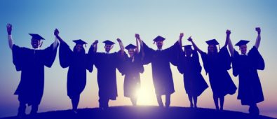 A Group Of Graduates Raising Hands In The Resemblence Of Their Graduation Success.