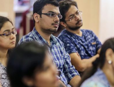 Group Of IIM And IIT Students Listening A Lecture In Classroom.