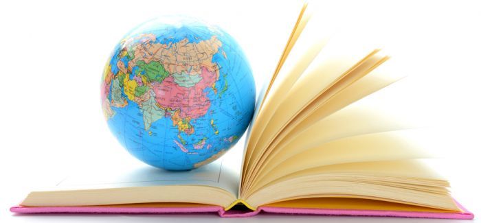 An Opened Book And Globe Placed Over It That Representing The Study Abroad concept.