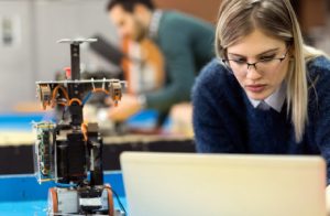 An Engineering Student Working In A Practical Class With The Help Of Laptop.