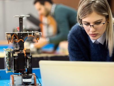 An Engineering Student Working In A Practical Class With The Help Of Laptop.