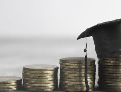 A Graduation Hat Placed Over The Coins.