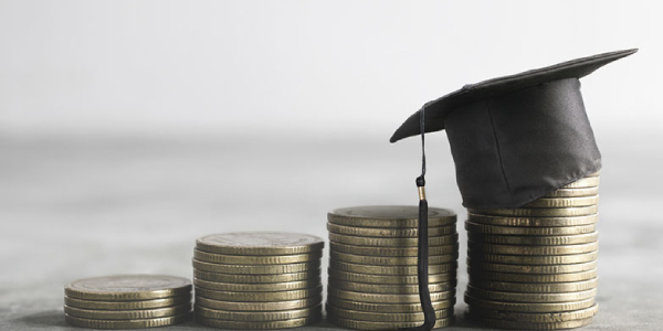 A Graduation Hat Placed Over The Coins.