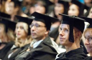 Group Of Abroad Students In Their Graduation Ceremony.