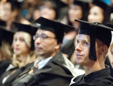 Group Of Abroad Students In Their Graduation Ceremony.