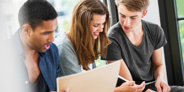 A Group of Three Collge Students Studying.