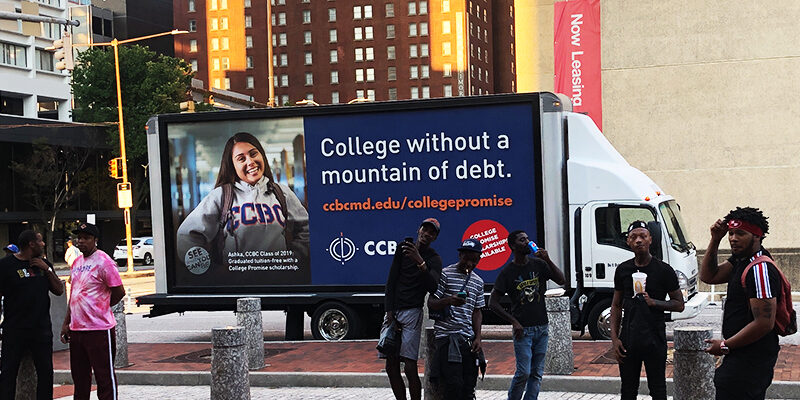 A Brightest Advertising Digital Mobile Billboard Moving Through The City About The Collge Advertisement To Attract Students For Their Higher Education.