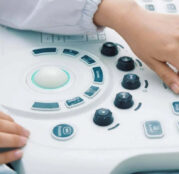 An individual operating the ultrasound machine