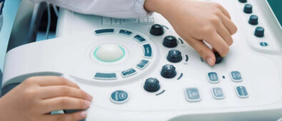 An individual operating the ultrasound machine