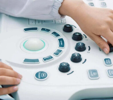 An individual operating the ultrasound machine